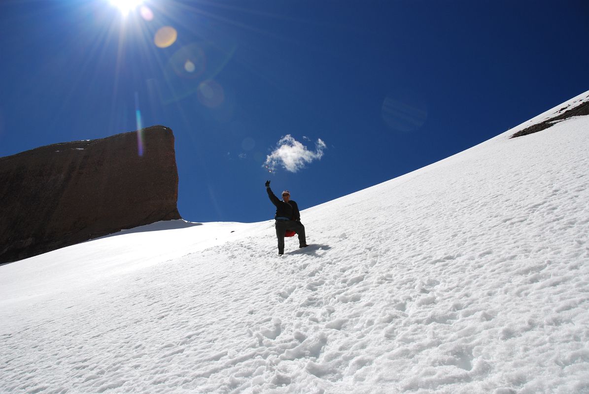 37 Gyan Tamang Descending The Snow Slopes On The Eastern Side Of The Nandi Pass On Mount Kailash Inner Kora Nandi Parikrama The descent from Nandi Pass to the Eastern Valley is on snow at first. Here my Nepalese guide Gyan Tamang descends with Nandi on the upper left.